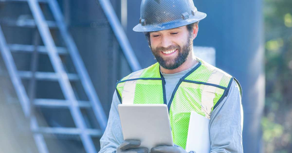 Construction man looking at tablet