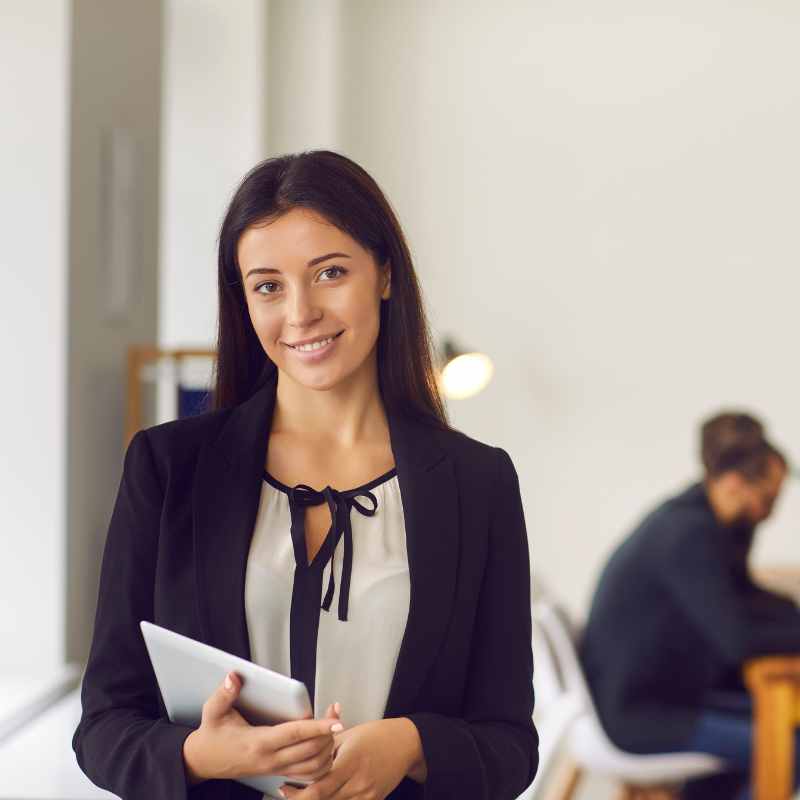 woman smiling with tablet