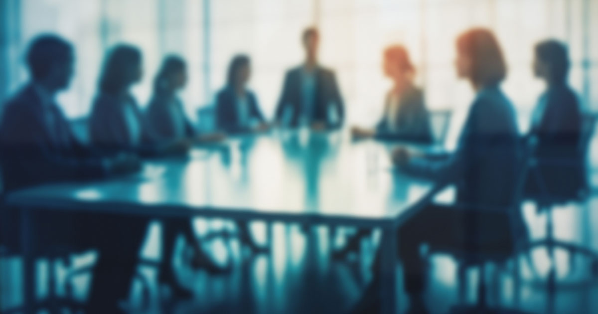 people sitting around a conference table