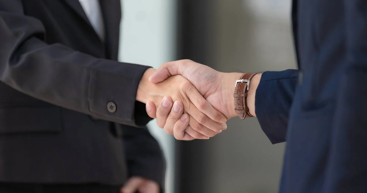 shaking hands people suits